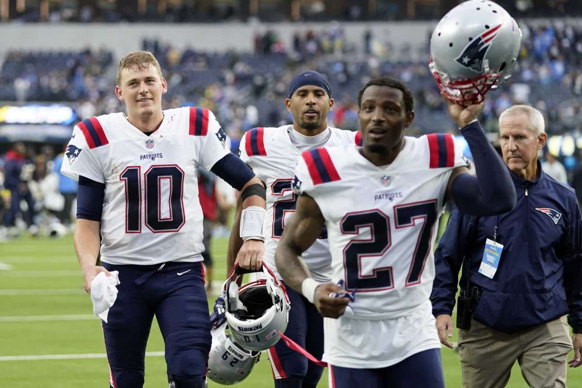 Patriots QB Mac Jones (10) and Cornerback J.C. Jackson (27)